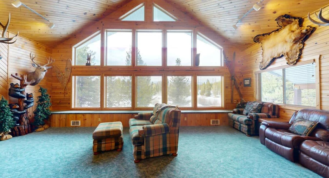 Natural light pours in through large windows, tying it all together with a view of the forest just beyond.