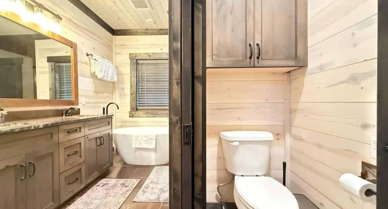 Toilet closet and the deluxe master shared bathroom.