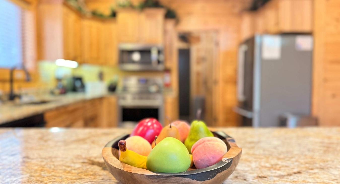 Every detail is designed for comfort. The expansive granite kitchen island offers plenty of open prep space to prepare fresh ingredients for your group.