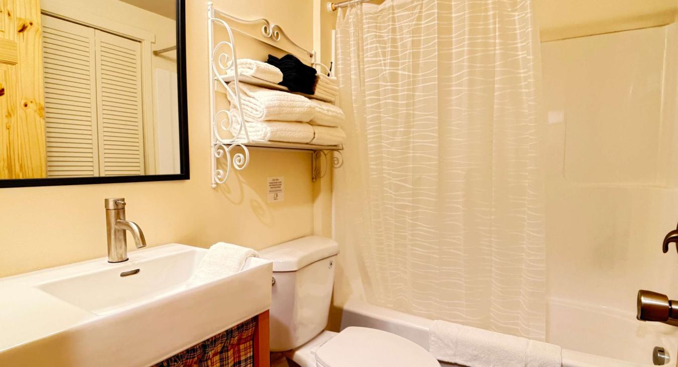 Full bathroom with tub and shower.