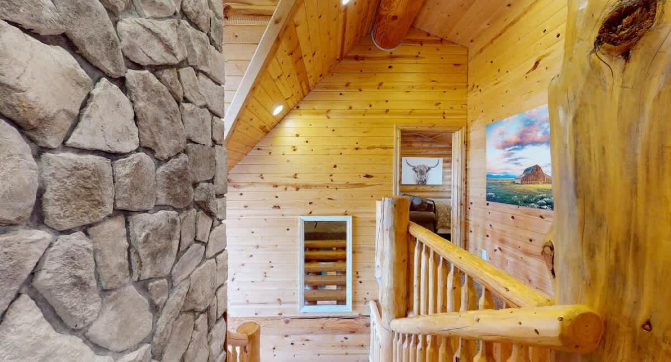 From the top of the stairs you can appreciate the beautiful stone from the fireplace.