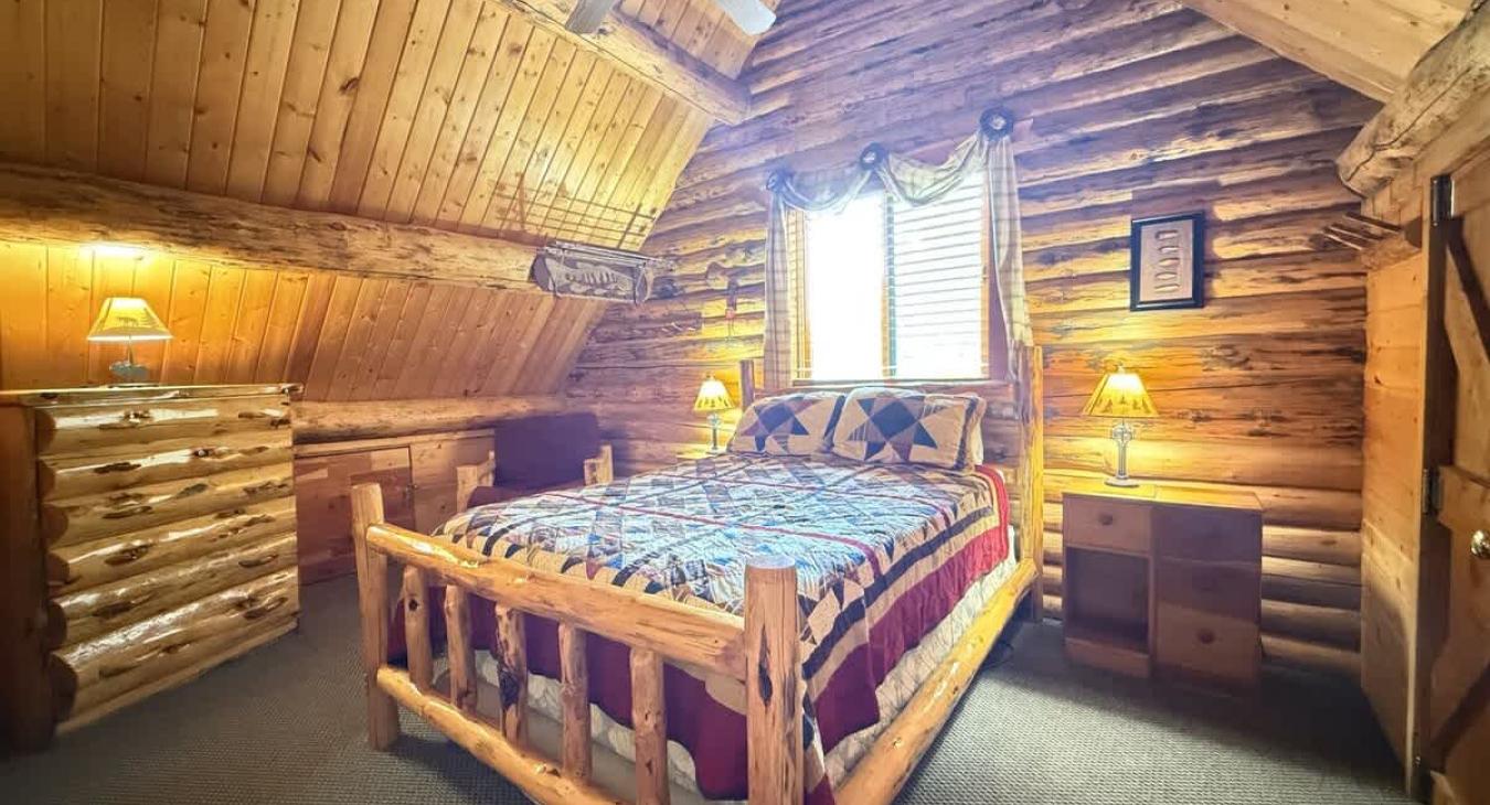 Bedroom #2 located upstairs with a Queen size bed.