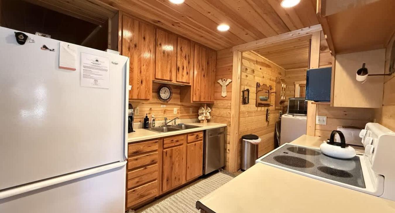 Large Galley Kitchen. Large fridge and dishwasher.