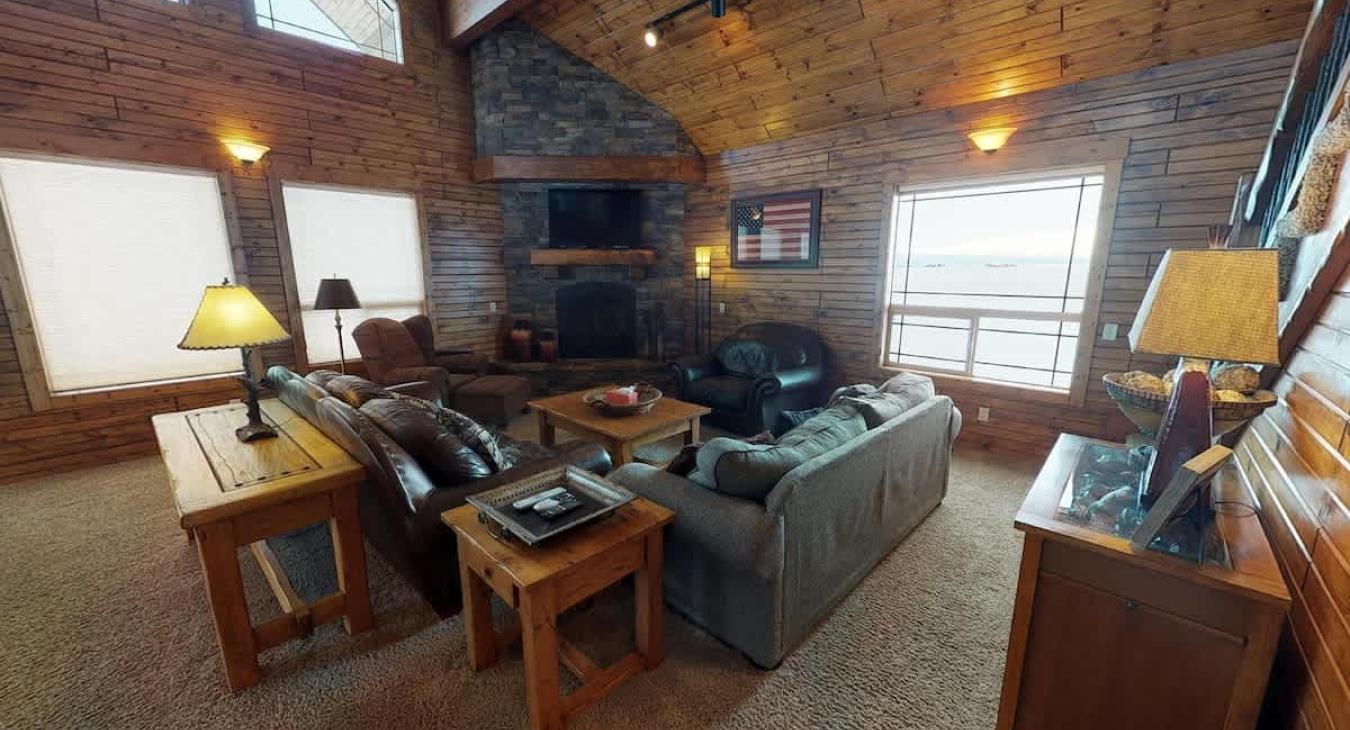The living room has a fireplace for you to enjoy, make sure to bring your own wood.