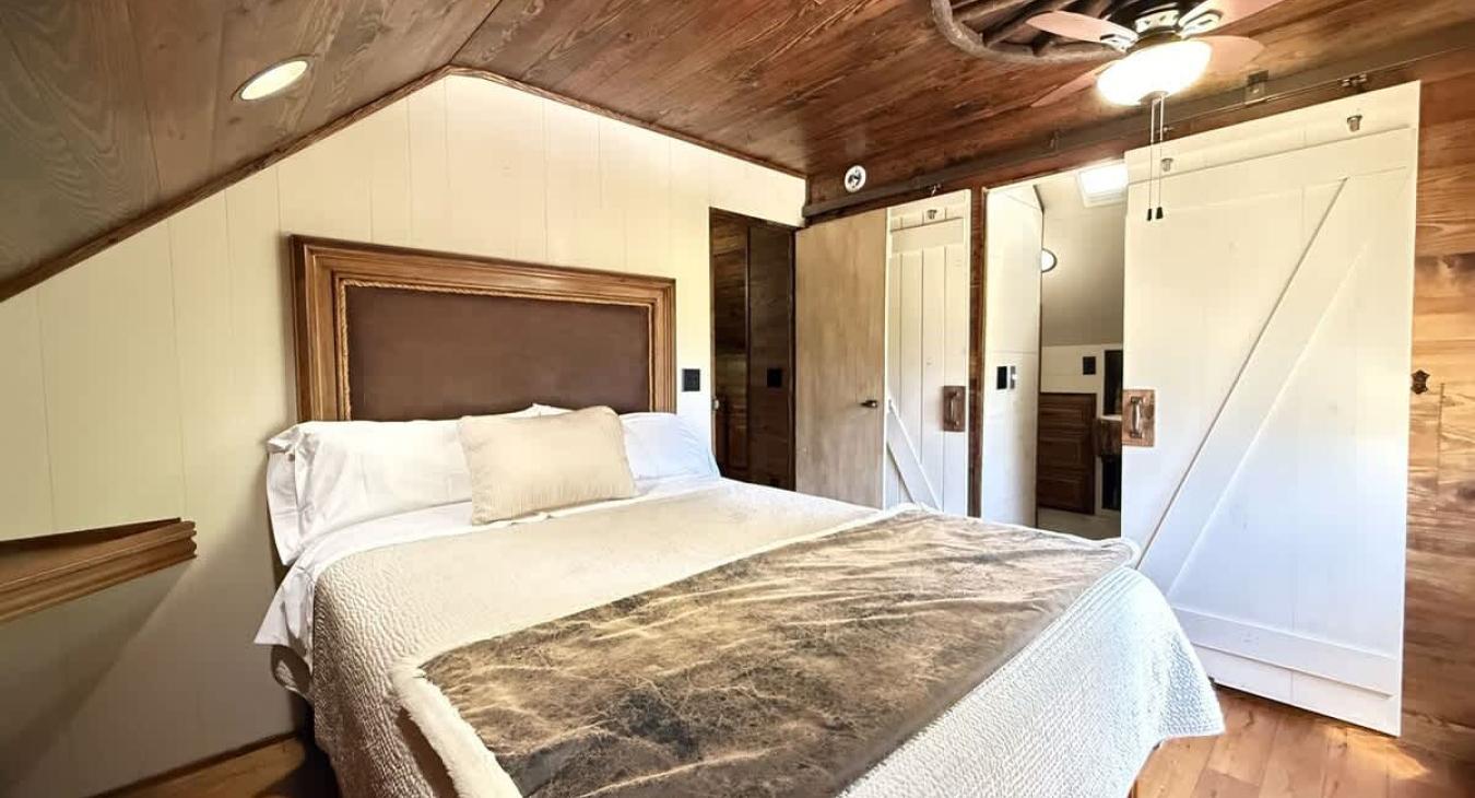The master bedroom is equipped with a queen bed and ensuite bathroom.