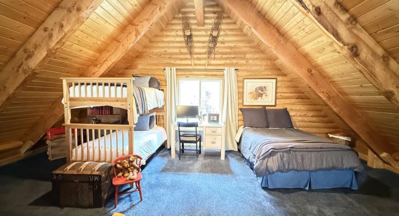 Upstairs loft with a Full bed, and 2 twins on the bunkbed.