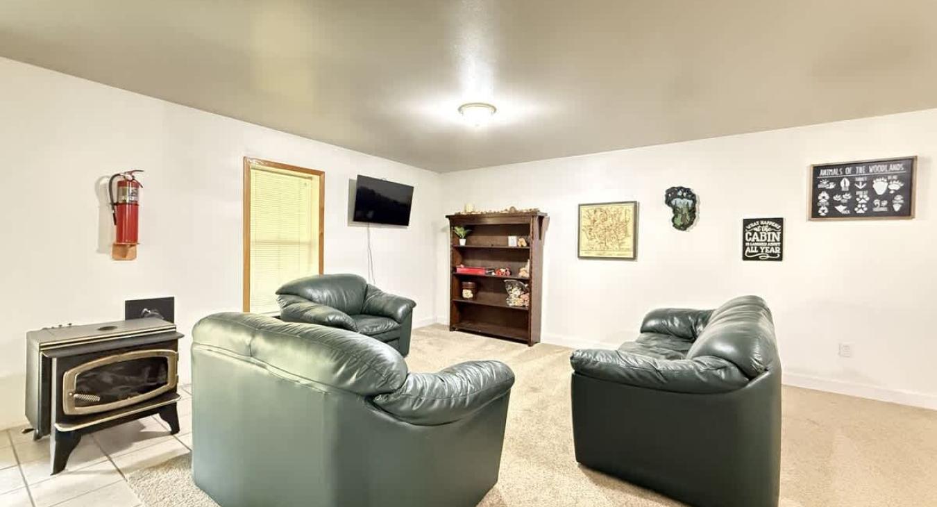 Spacious seating area with games and a tv.
