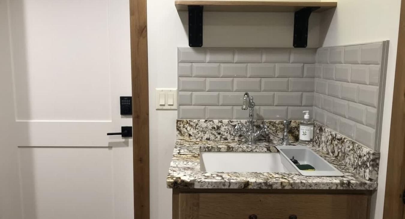 Laundry room also has a sink for additional needs.