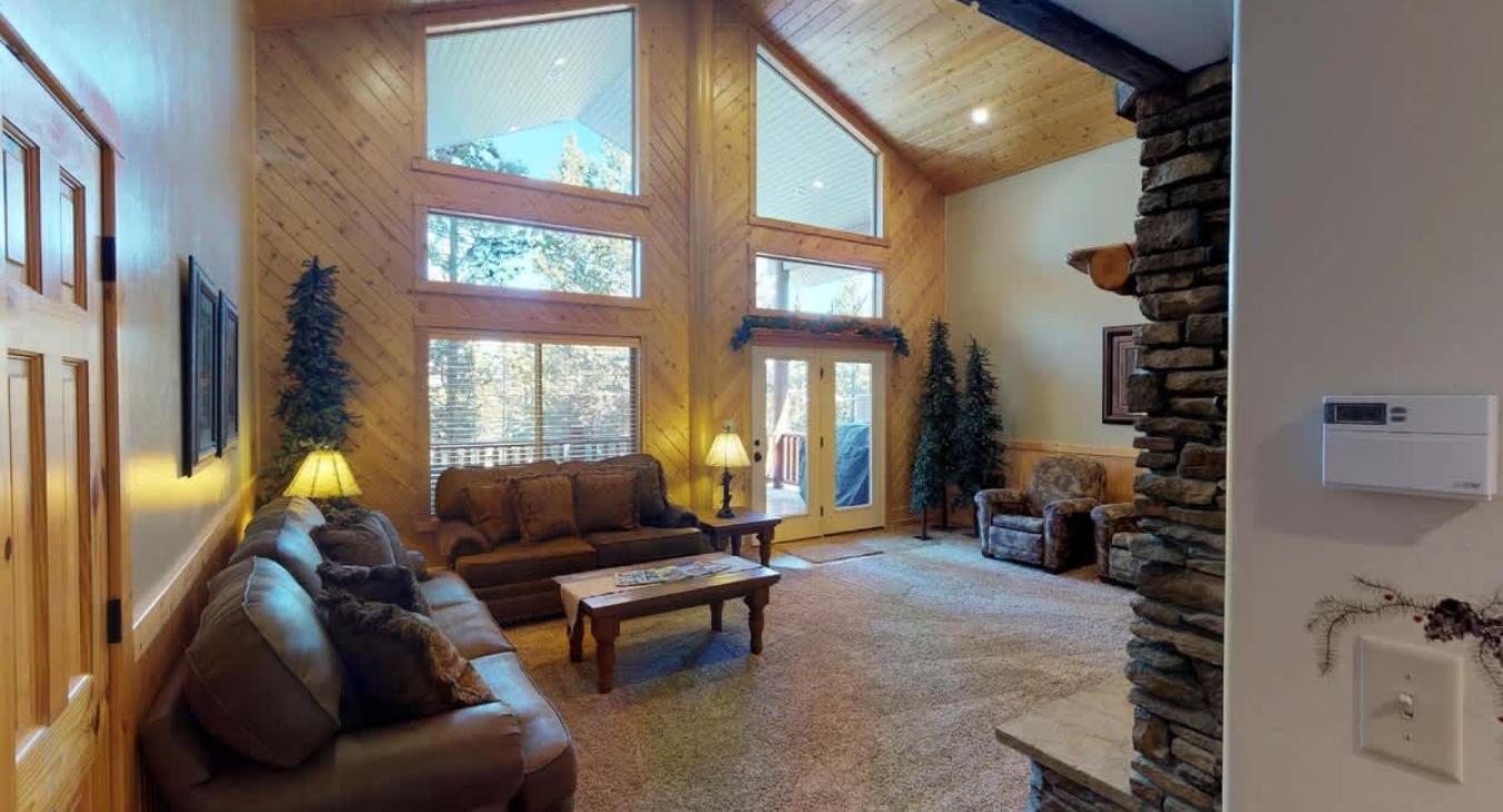 Natural light pours in through large windows, tying it all together with a view of the forest just beyond.