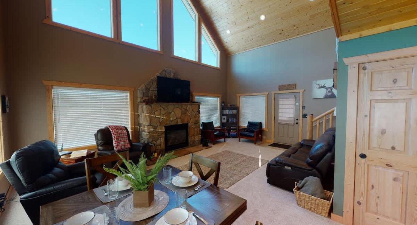 Dining room table is adjacent to the living room and kitchen. Perfect for up to 4 people.