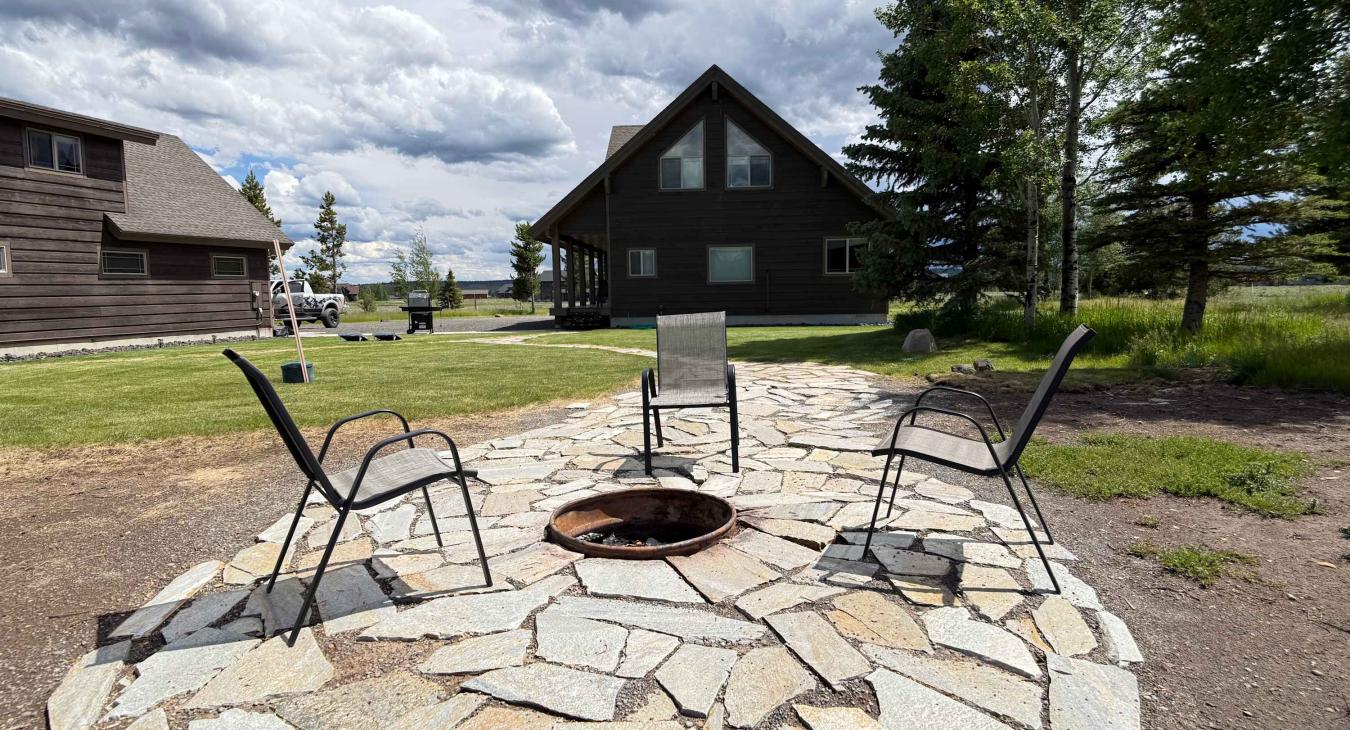 Gather around the stone fire pit during the day to plan your next adventure, surrounded by stunning open nature.