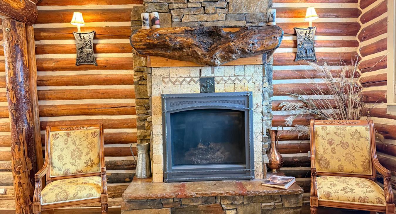 Enjoy the cozy ambiance of the open living room, featuring comfortable seating and a beautiful propane gas fireplace.