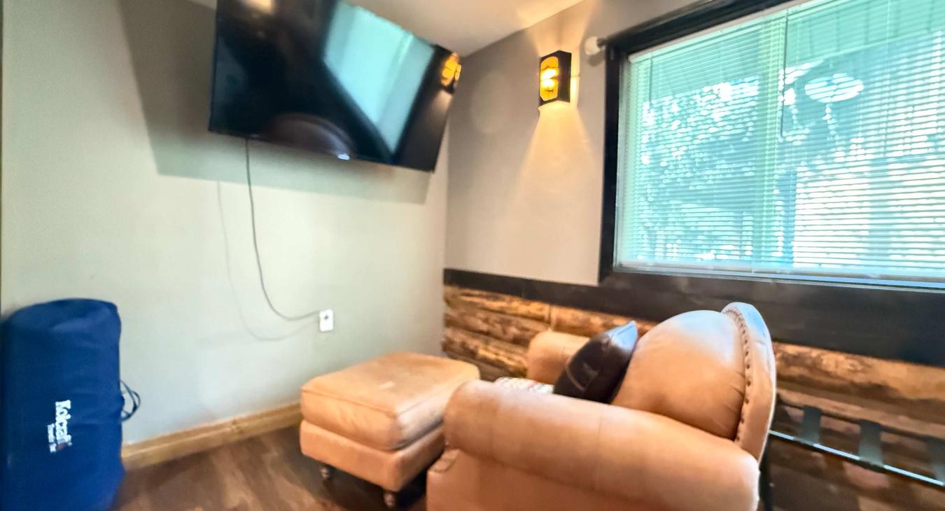 Every corner is designed for comfort—enjoy your favorite shows right from the master bedroom's dedicated seating and Smart TV setup.