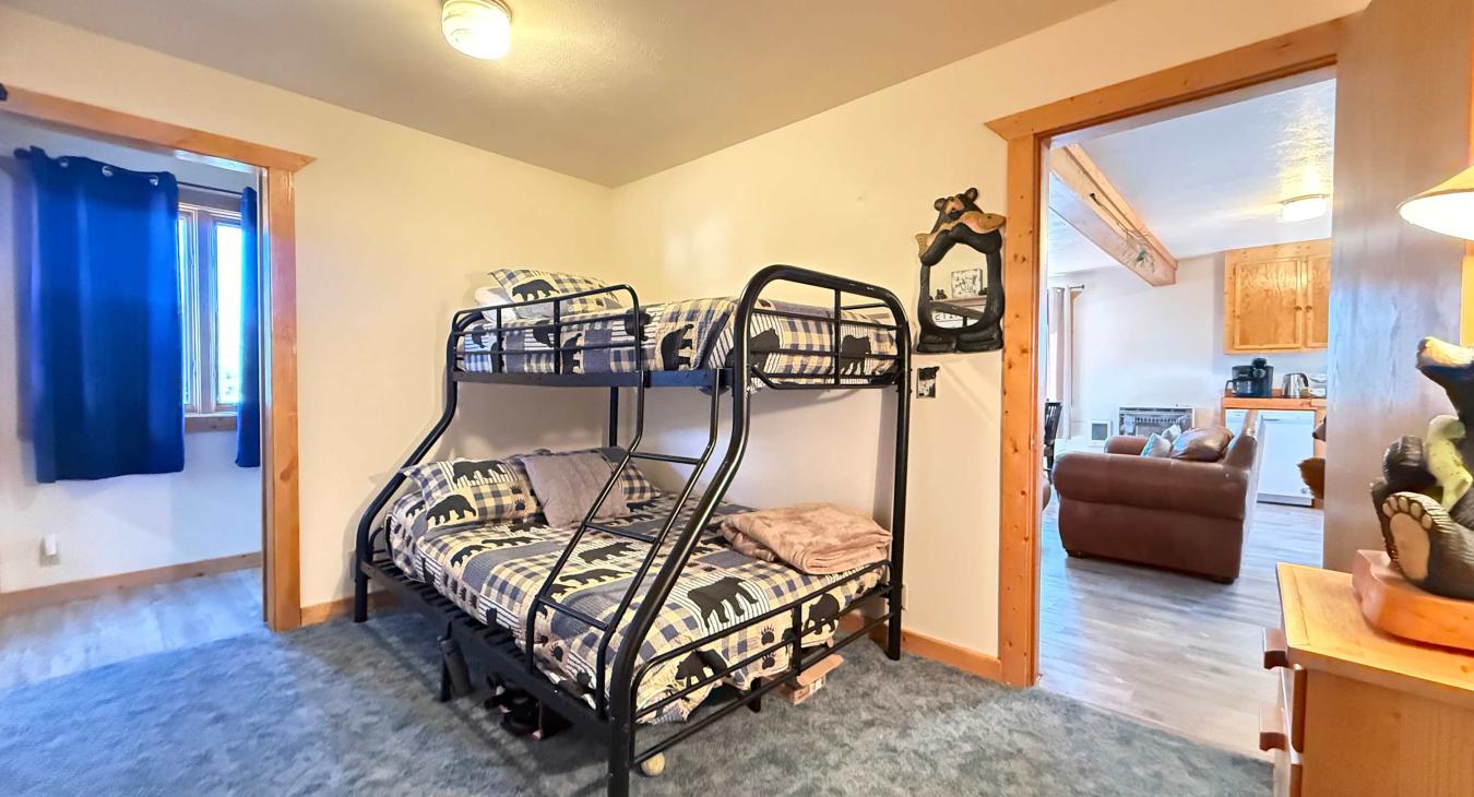 Main level private bedroom. Bunkbed with full lower bed and twin upper.