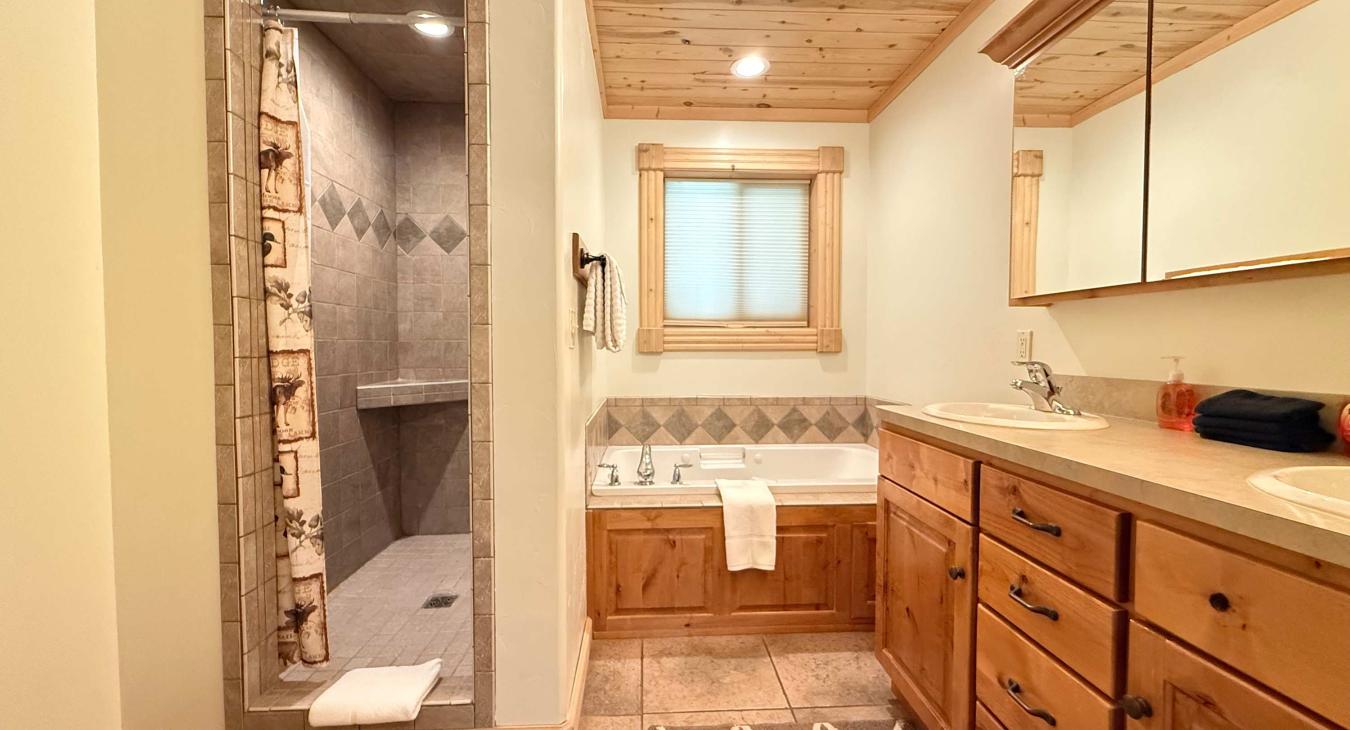 Master ensuite bathroom with large walk in shower and jetted tub.