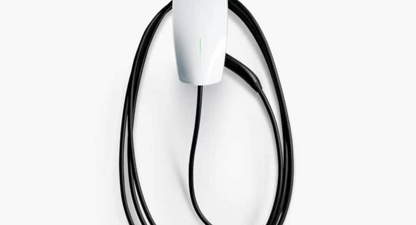 Tesla universal electric car charger in the garage. 