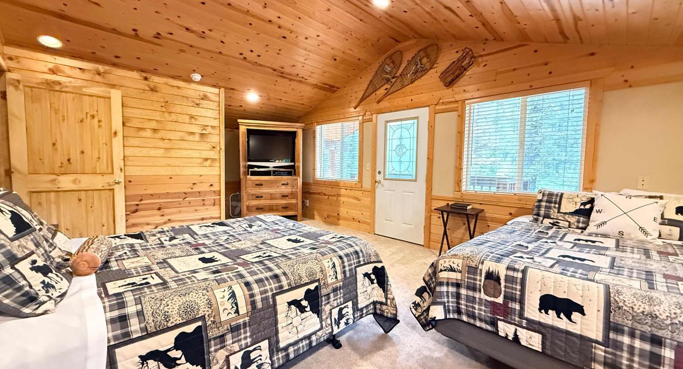 Second private bedroom with tv and balcony. 