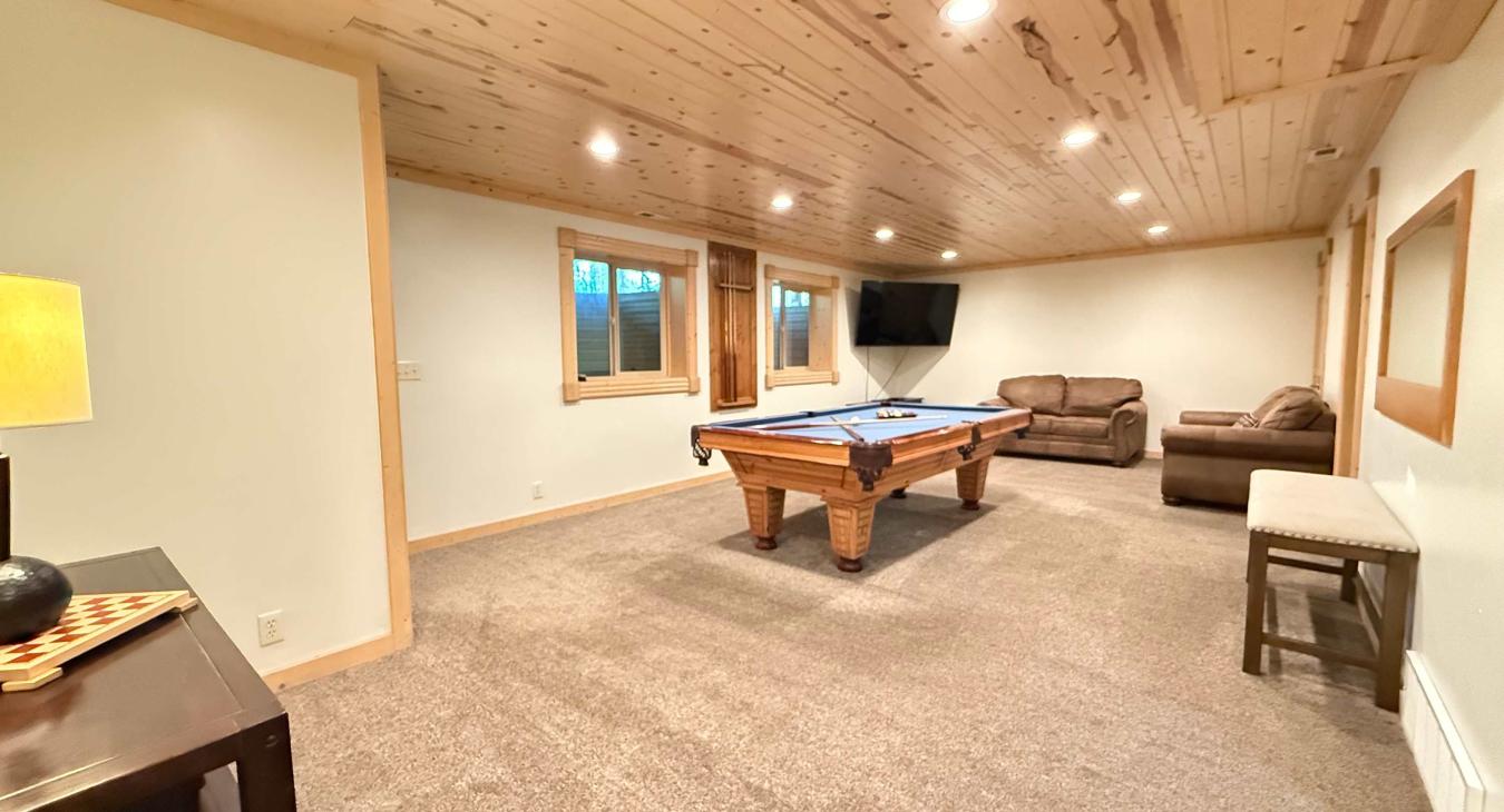 Basement Living area with a Pool Table.