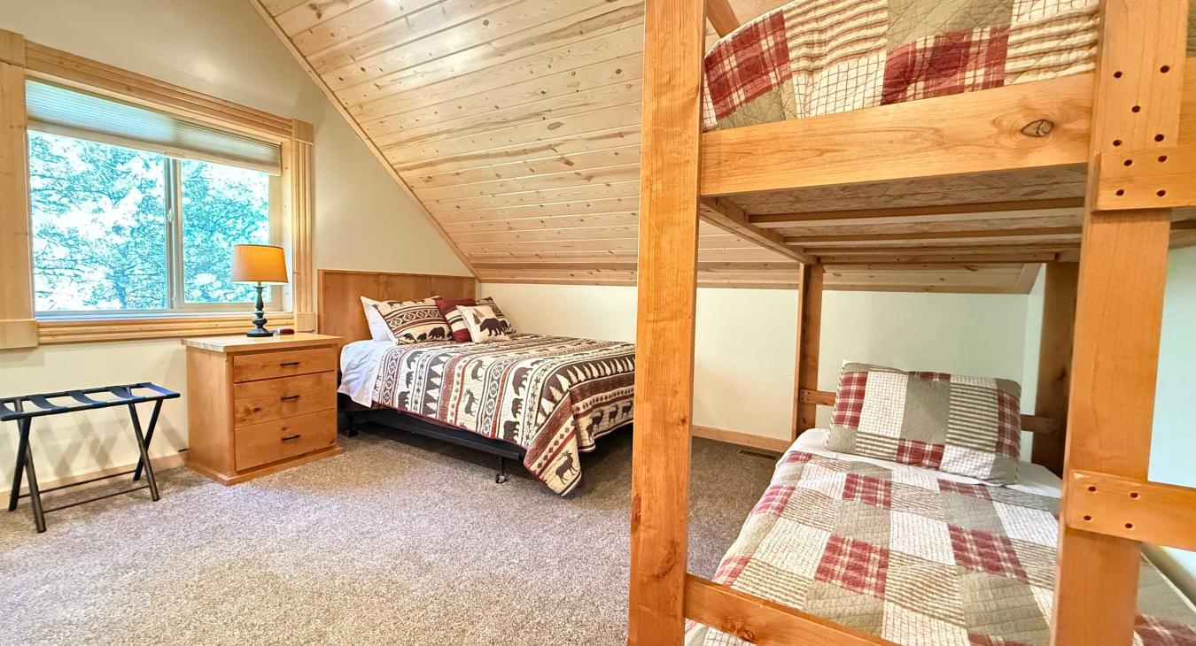 Bedroom #1 located upstairs with a Queen and bunk bed.