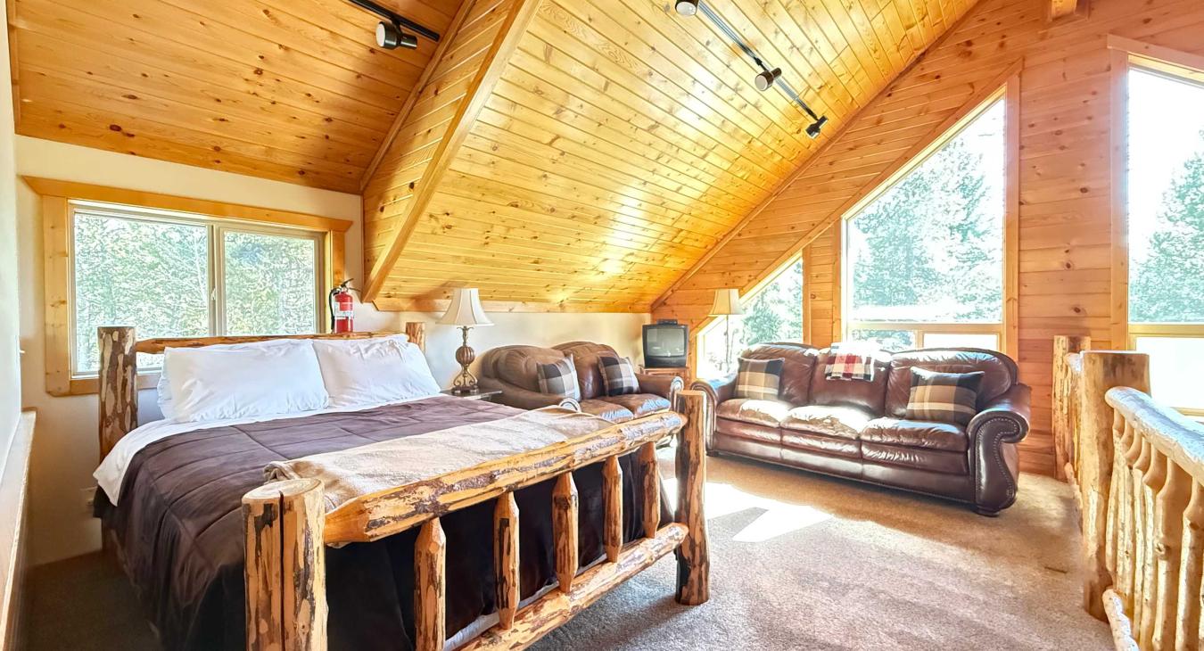 Loft with a Queen bed and additional seating.