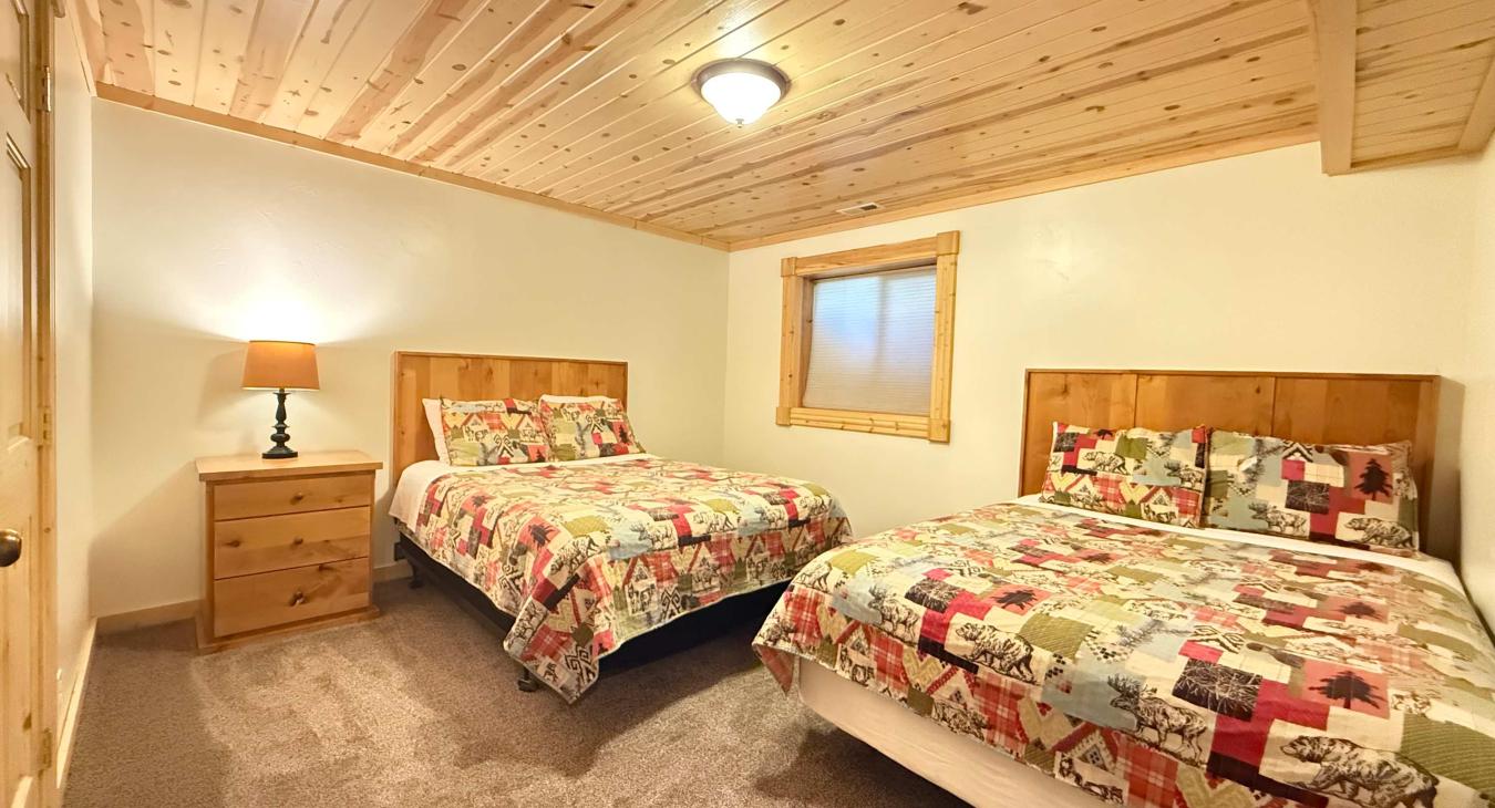 Bedroom #6 located downstairs with 2 Queen beds.