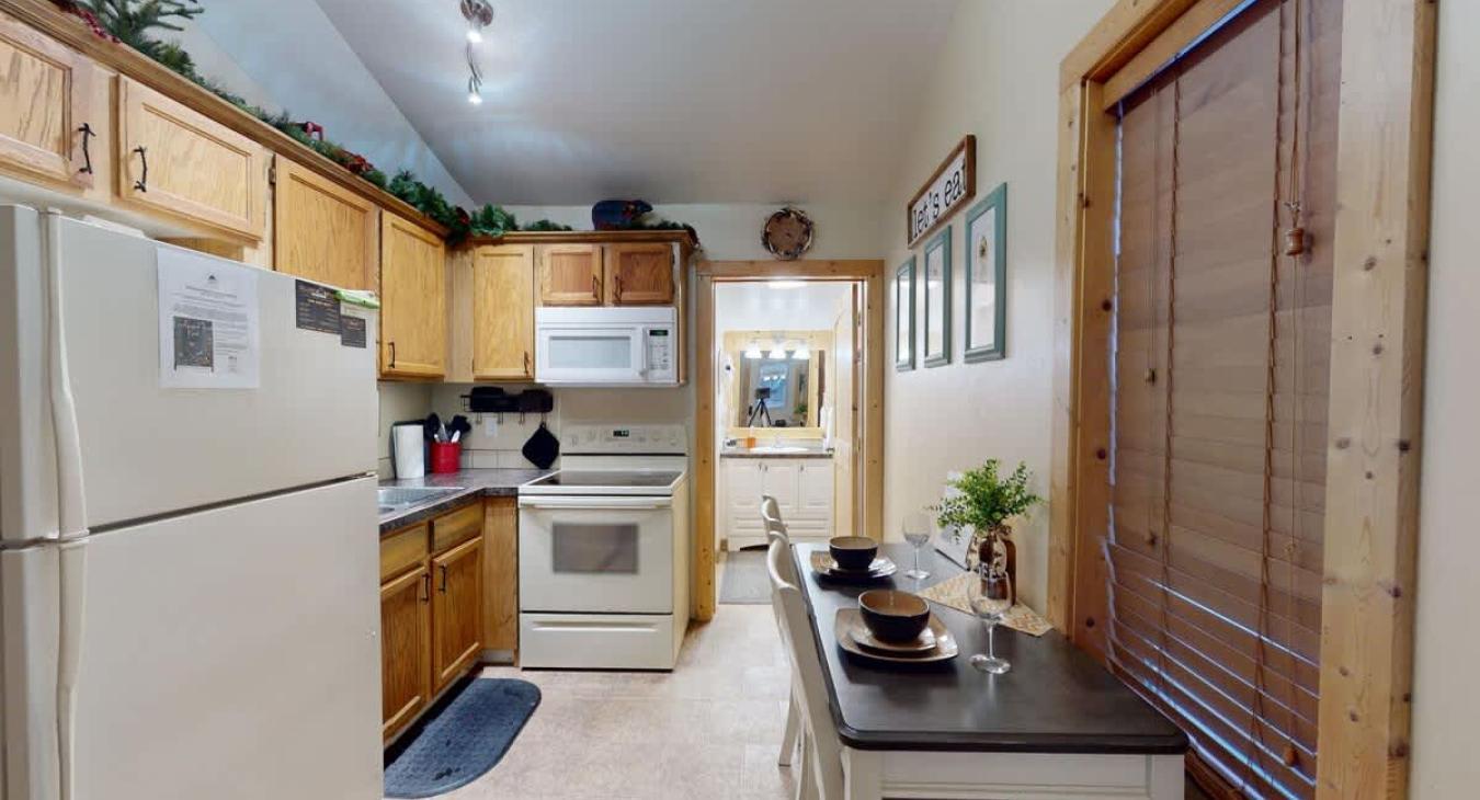 When you enter you are greeted by the kitchen and dining area.