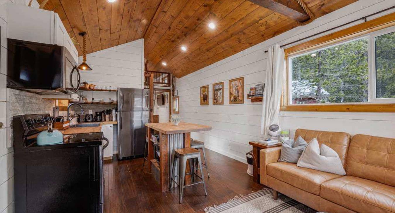 Fully stocked kitchen with island and seating.