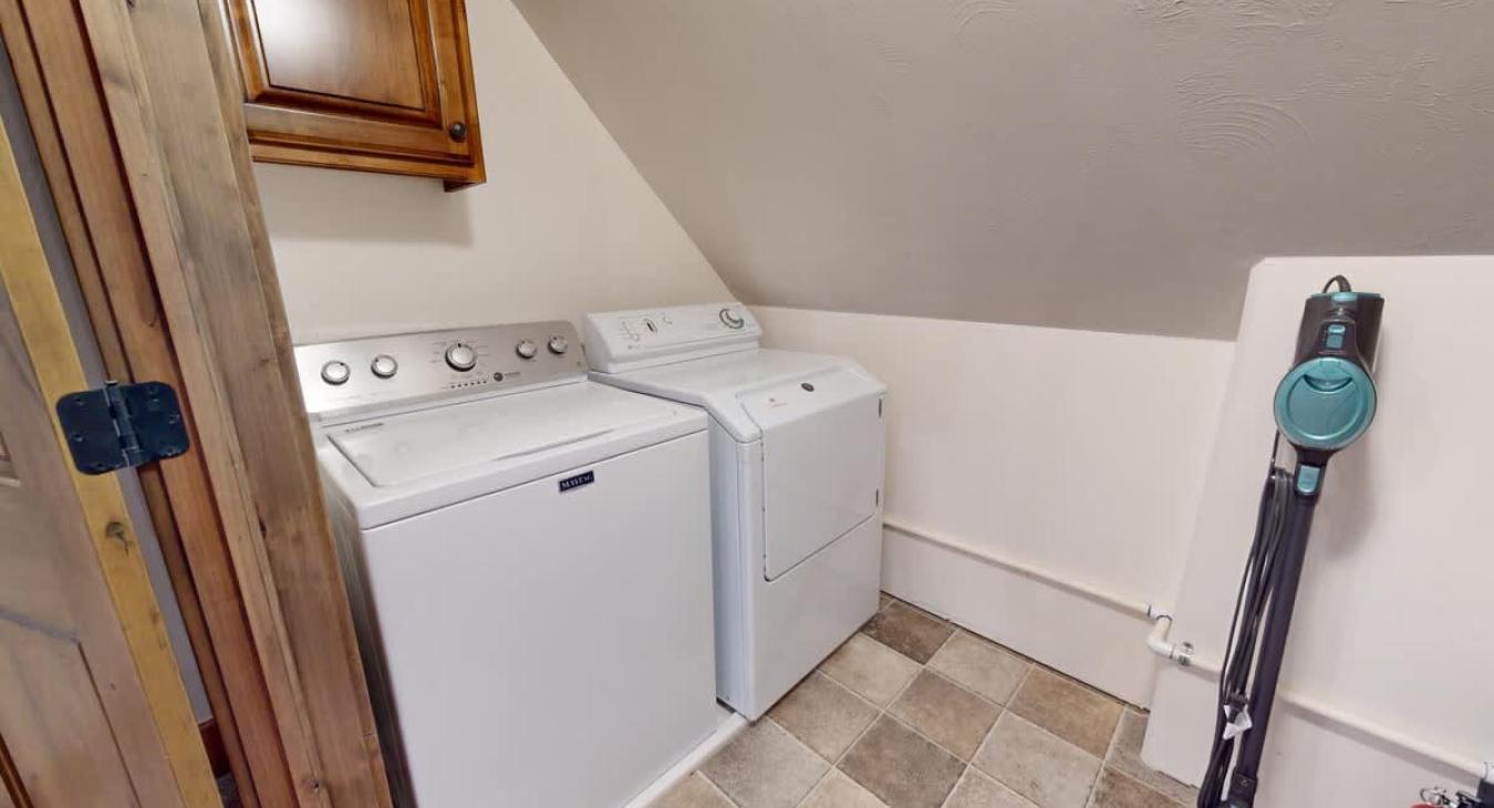 Set of full size washer and dryer located here. Laundry soap is also provided.