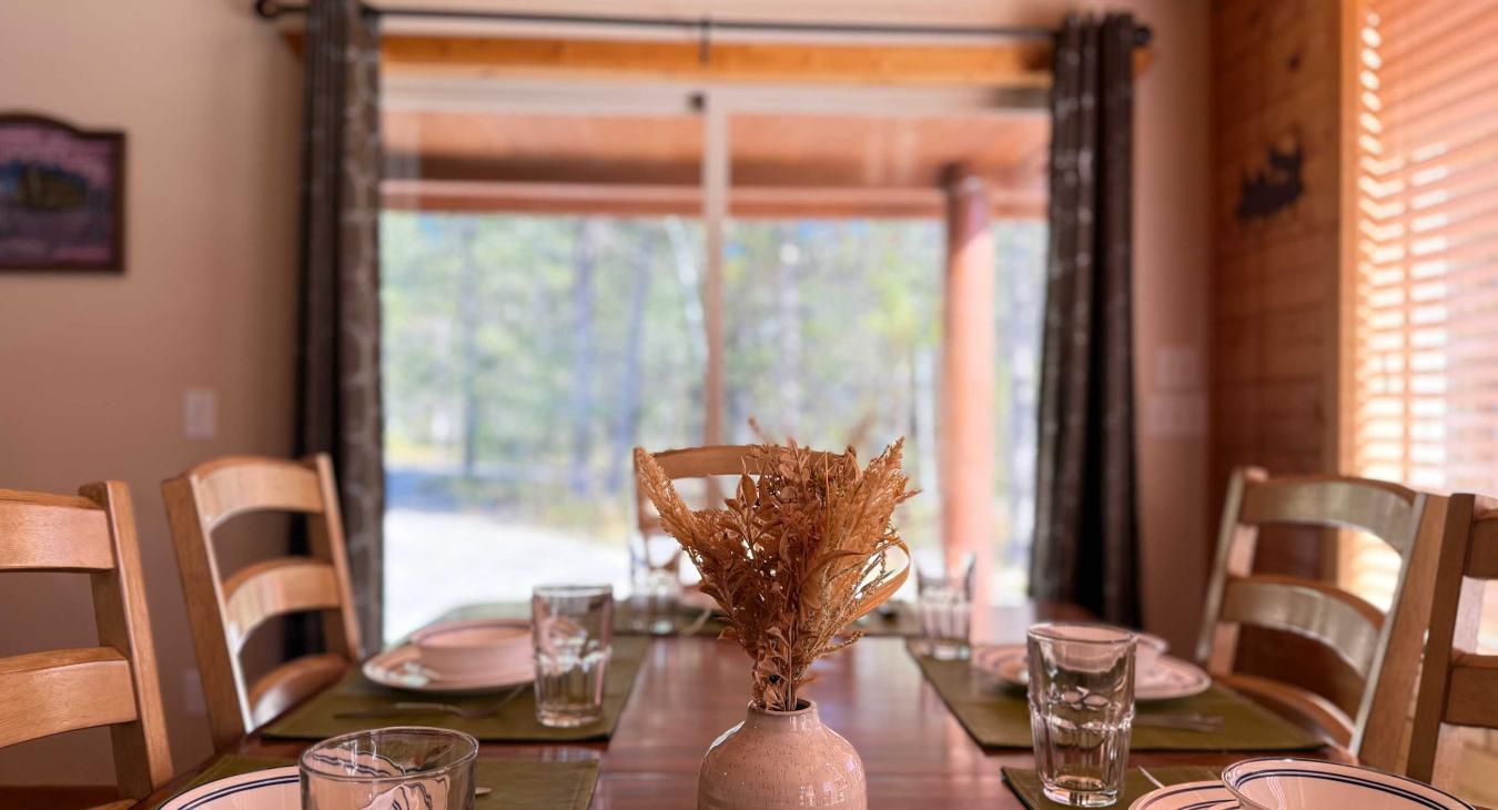 Dining table with seating for up to 8 people with 6 additional seats at the kitchen island.