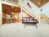 Open living area and access to the upper level.