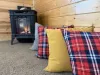 Relax by the fire in the cozy living room.