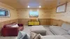 Downstairs living room with seating and tv for entertainment.
