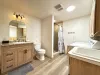 Lower level bathroom with shower, toilet, and sink vanity. Also includes full size washer and dryer for your use, laundry soap is provided.