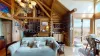 Natural light pours in through large windows, tying it all together with a view of the forest just beyond.