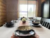 Dining room table is located adjacent to the cabin. Perfect for up to 7 people with additional seating at the island.