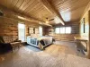 The master bedroom is located in the downstairs bedroom with an ensuite bathroom attached.