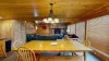 Dining area that seats up to 8 people with additional bar stools at the kitchen island.
