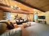 Living room on the main floor equipped with a fireplace and smart tv.