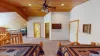Across from the beds is the third bedroom and upstairs shared bathroom.