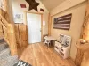 A small play kitchen is here for the kiddos to enjoy.