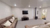 Couch and tv for entertainment.