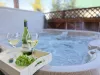 Unwind and relax in the hot tub that is located outside cabin.
