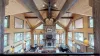 Natural light pours in through large windows, tying it all together with a view of the forest just beyond.