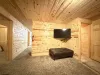 Basement level with smart tv an seating.