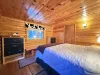Main bedroom with queen bed and storage for you to use during your stay.