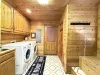 Laundry room with full size washer and dryers with provided laundry soap.