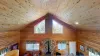 Natural light pours in through large windows, tying it all together with a view of the forest just beyond.