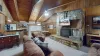 Beautiful living room with a fireplace and seating. Make sure to bring your own wood.