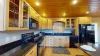 Kitchen is equipped with appliances, cookware, dishes, silverware, and spices.