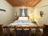 Bedroom #5 located in the basement with a Queen size bed.